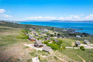 Aerial perspective of suburban area with a large body of water