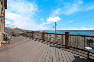 Deck featuring a lake view