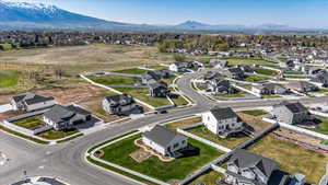 Birds eye view of property featuring a mountain view and a residential view