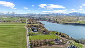 Drone / aerial view featuring a water and mountain view