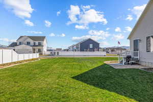 View of yard featuring a residential view and fence