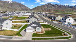 Birds eye view of property with a mountain view and a residential view