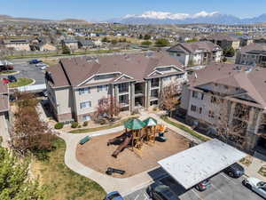 Birds eye view of property with a mountain view and a residential view