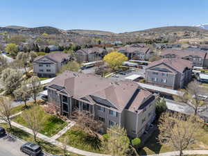 Birds eye view of property with a mountain view and a residential view