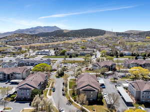 Birds eye view of property featuring a mountain view and a residential view