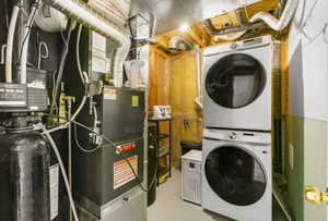 Laundry area with stacked washer / dryer and laundry area