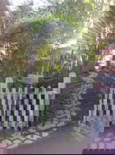 View of gate featuring fence
