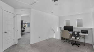 Carpeted home office with recessed lighting, visible vents, and baseboards