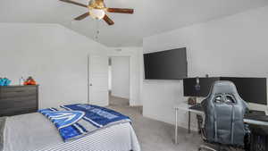 Bedroom with visible vents, baseboards, a ceiling fan, carpet, and lofted ceiling