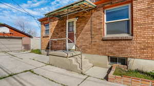 View of side of property with brick siding and driveway