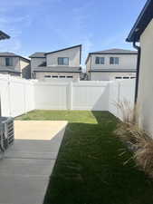 View of yard featuring cooling unit and a fenced backyard