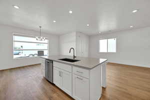 View of large kitchen, dining, and family room with large windows and 9 foot ceilings.