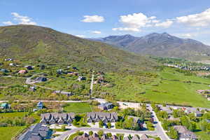 Birds eye view of property with a mountain view and a residential view