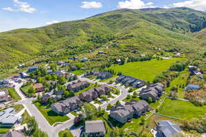 Birds eye view of property with a mountain view and a residential view