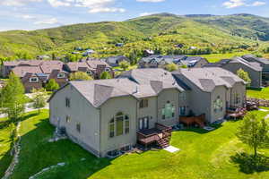 Drone / aerial view with a residential view and a mountain view
