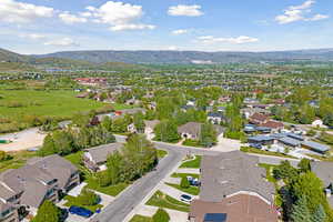 Birds eye view of property featuring a mountain view and a residential view