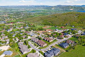 Drone / aerial view with a residential view and a water and mountain view