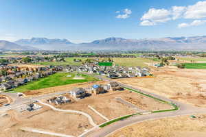 Aerial view of residential area featuring a mountainous background
