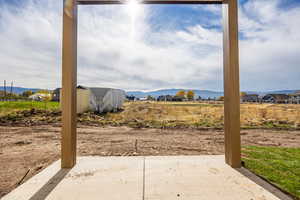 View of yard featuring a mountain view and a patio area