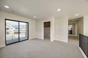Unfurnished room featuring light colored carpet and recessed lighting