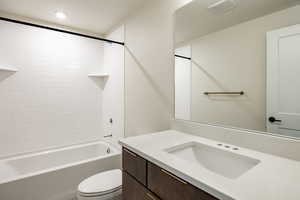 Full bathroom featuring shower / tub combination and vanity