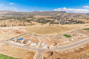 Overview of rural landscape with mountains and nearby suburban area