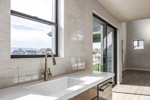 Bathroom with light wood finished floors and vanity