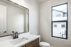 Bathroom with vanity and toilet