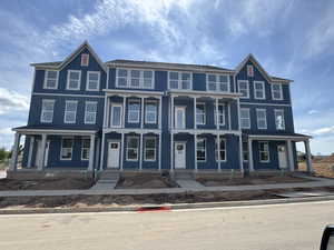 View of front of house with covered porch
