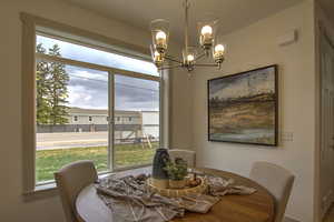 Dining room featuring a chandelier and plenty of natural light