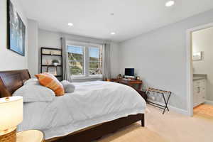 Bedroom featuring recessed lighting, light colored carpet, and baseboards