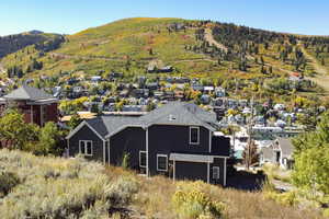 Birds eye view of property with a residential view and a mountain view