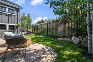 View of yard with a patio and a fenced backyard