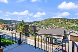 Balcony featuring a mountain view and a residential view