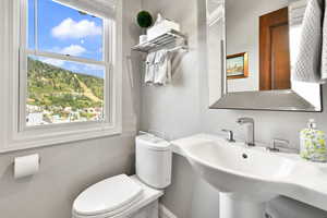 Half bath featuring a sink and toilet