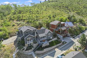 Birds eye view of property with a view of trees