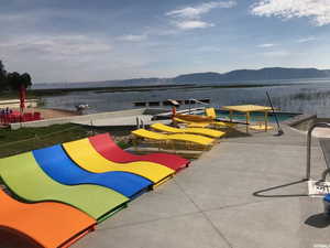View of community with a mountain view and a dock
