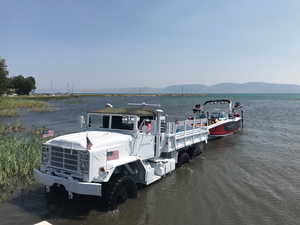 View of dock featuring a water and mountain view