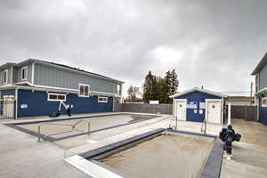 Exterior space featuring board and batten siding and fence