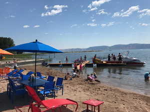 View of dock featuring a water and mountain view