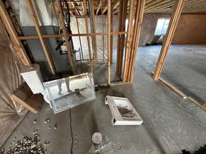 Miscellaneous room with concrete floors