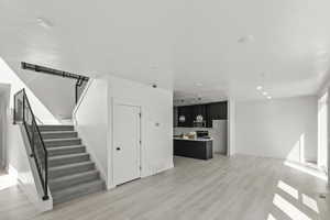 Interior space featuring visible vents, recessed lighting, wood finished floors, and baseboards
