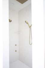 Full bathroom featuring tiled shower