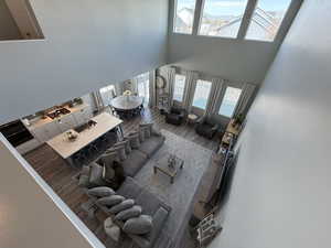 Living room with a high ceiling and wood finished floors