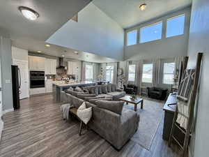 Living area with wood finished floors and baseboards