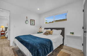 Bedroom featuring recessed lighting, baseboards, and wood finished floors