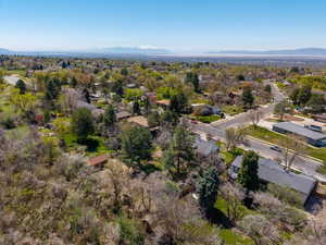 Birds eye view of property with a mountain view and a residential view