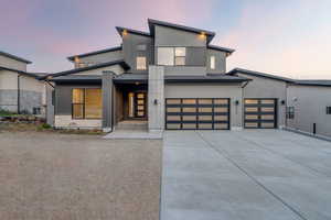 Modern home with driveway and an attached garage