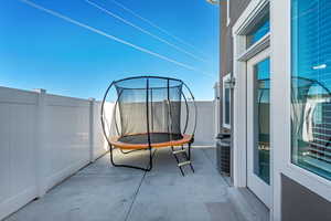 Balcony featuring central AC and a patio