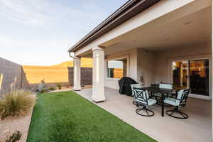 Exterior space with a grill and fence